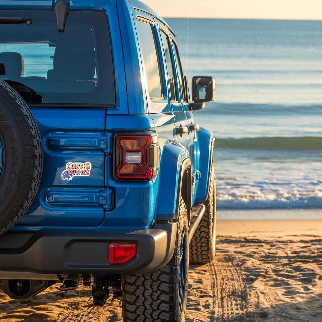 Crabs and Crushes Die Cut Vinyl Sticker on a blue suv at the beach