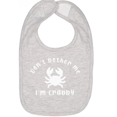 Gray baby bib with white text Don't Bother Me I'm Crabby and crab graphic