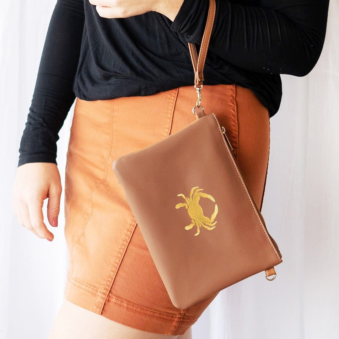 Embroidered Gold Crab Wristlet Model