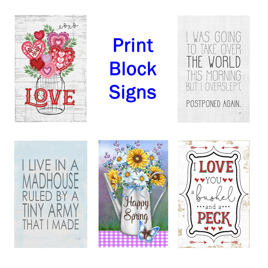 A collection of decorative print block signs with various designs and sayings, displayed on a white background.