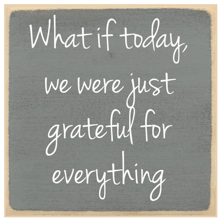 Gray wooden sign with white text &