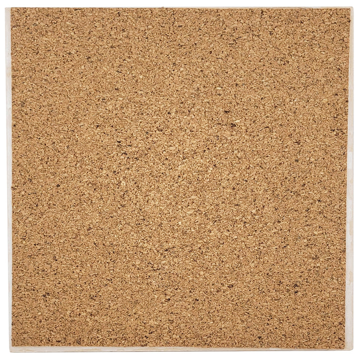 The cork backing of a  square decorative ceramic trivet featuring the Maryland state flag design on the reverse.