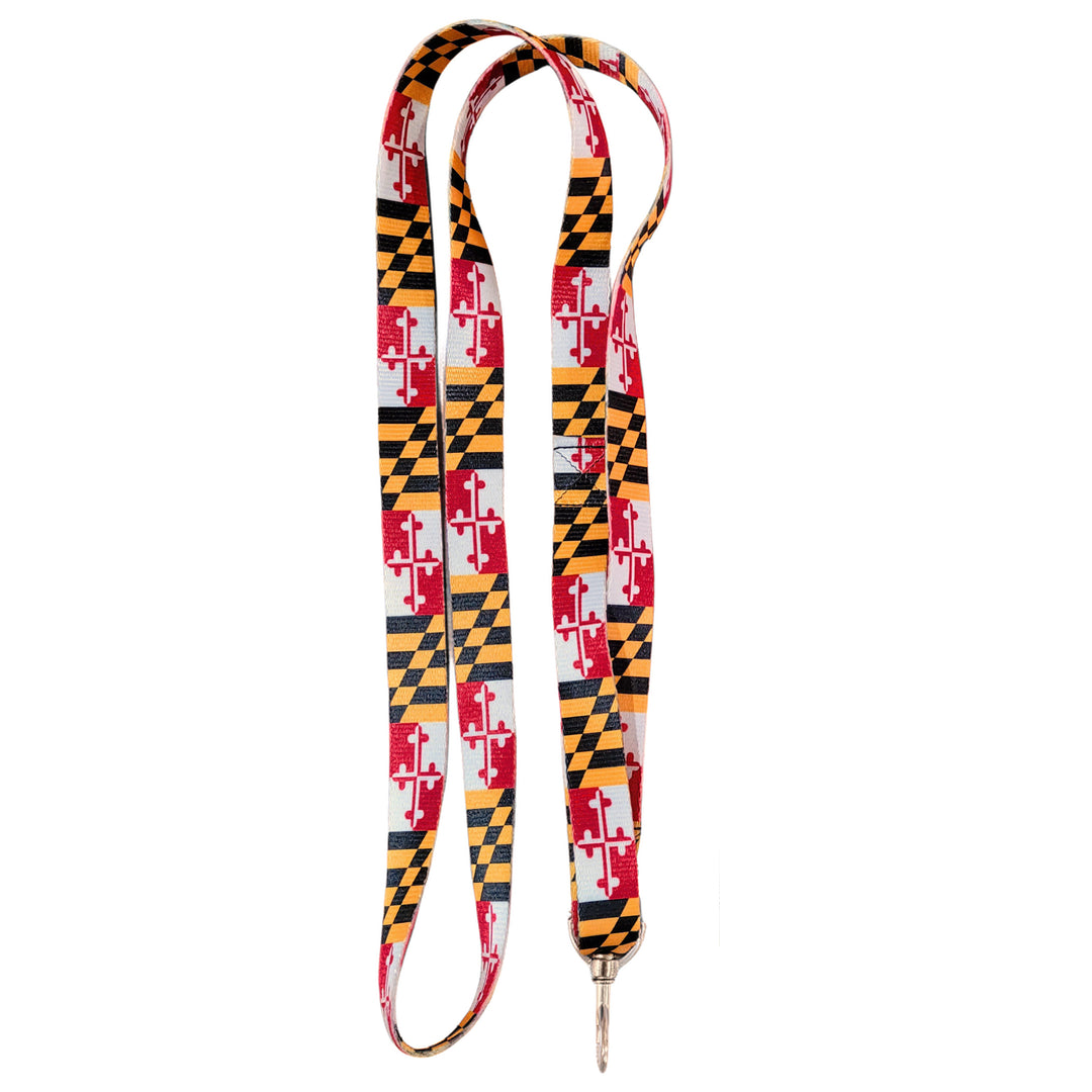 A fabric lanyard featuring the Maryland state flag pattern with red, white, black, and gold checkers and quartered shields, finished with a silver-tone metal swivel clasp.