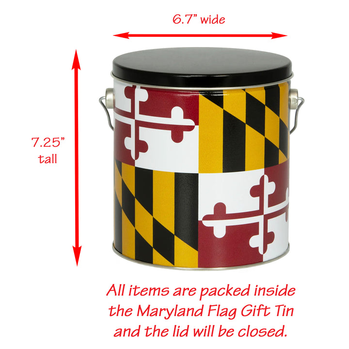 A cylindrical gift tin printed with the Maryland state flag design, shown on a white background with red dimension arrows indicating 6.7 inches wide, 7.