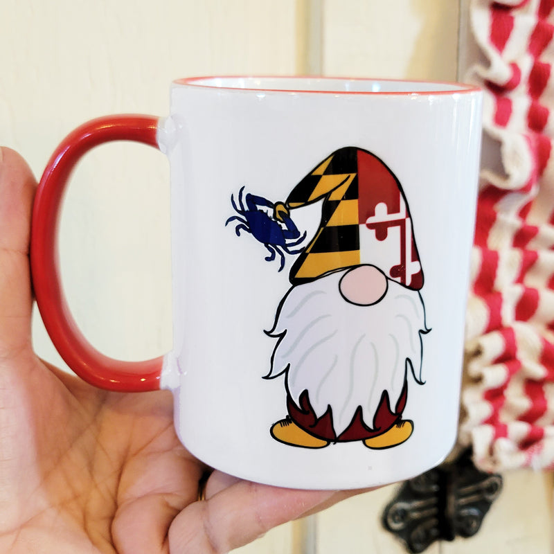 Hand holding Maryland Flag Gnome Red Trim Coffee Mug