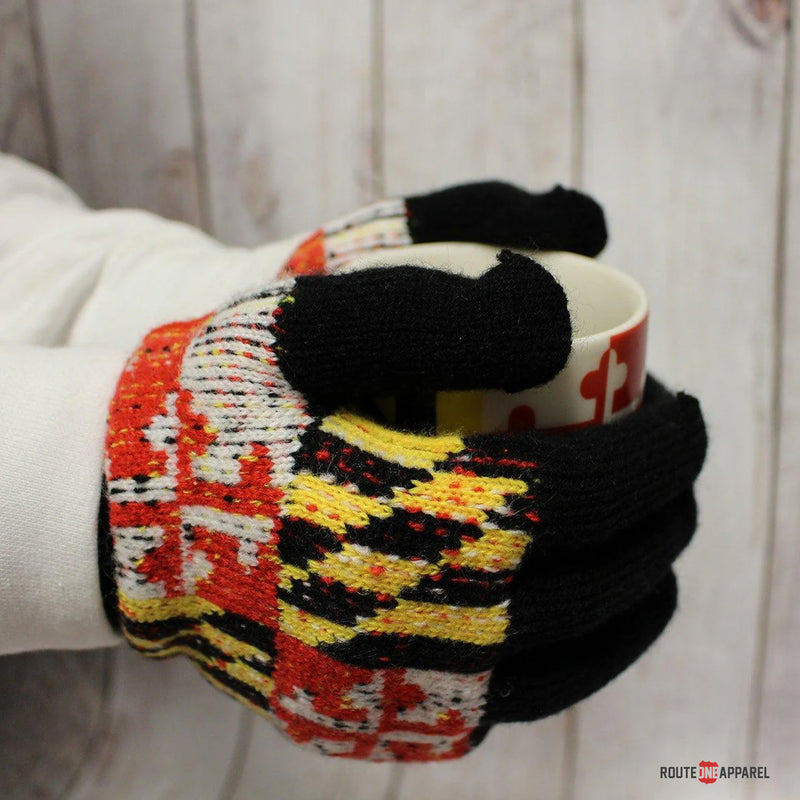 Maryland Flag gloves holding a mug with a white background