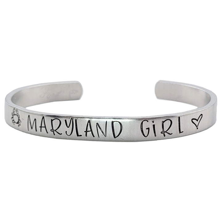 Silver colored bracelet with &
