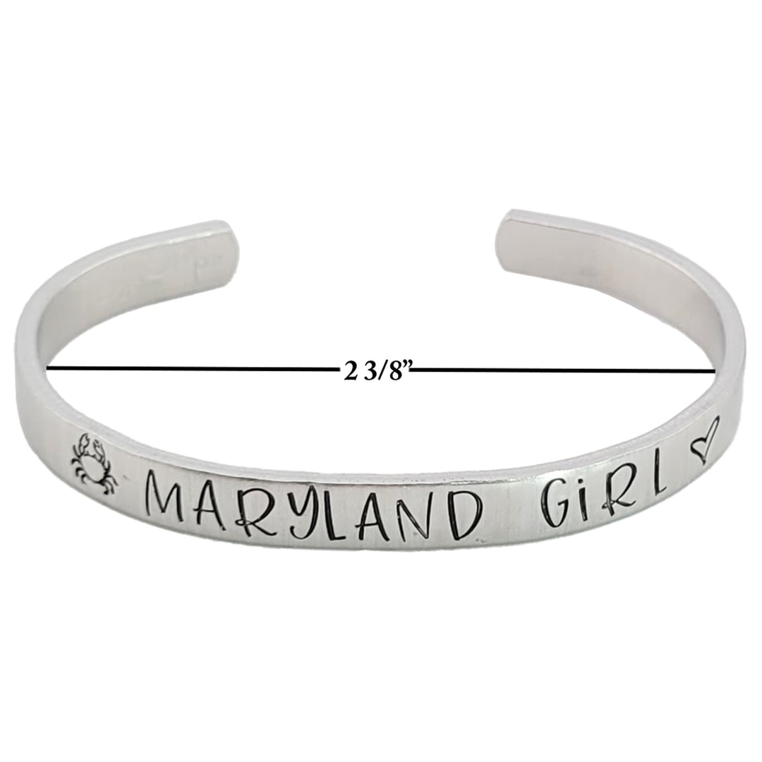 Silver colored bracelet with &