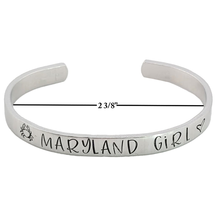 Silver colored bracelet with &