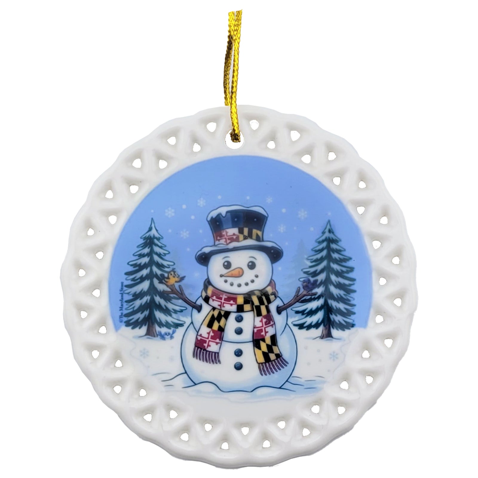 Maryland snowman ceramic ornament - a snowman with a Maryland flag scarf and hat with an oriole and a raven perched on the wood branch arms with pine trees in the background all on a round ceramic base