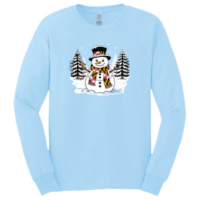 long sleeve t-shirt with front design of a snowman with Maryland Flag scarf and hat band with an oriole and raven on stick arms and a red crab under a pine tree with snow on the ground and trees