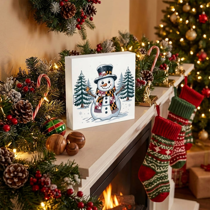Maryland Snowman Winter Wonderland 5" Box Sign on a mantle.