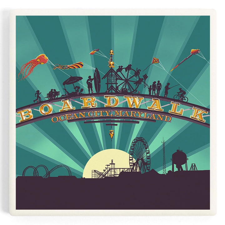 A ceramic drink coaster featuring a stylized Boardwalk, Ocean City, Maryland scene with silhouettes of people, kites, amusement park rides, and sunburst rays.