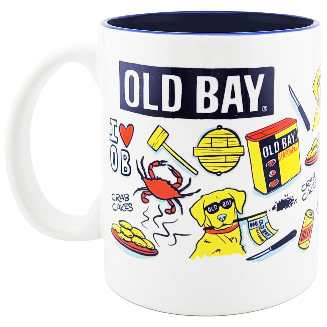 A white ceramic mug with a dark navy blue interior and handle, featuring a colorful &