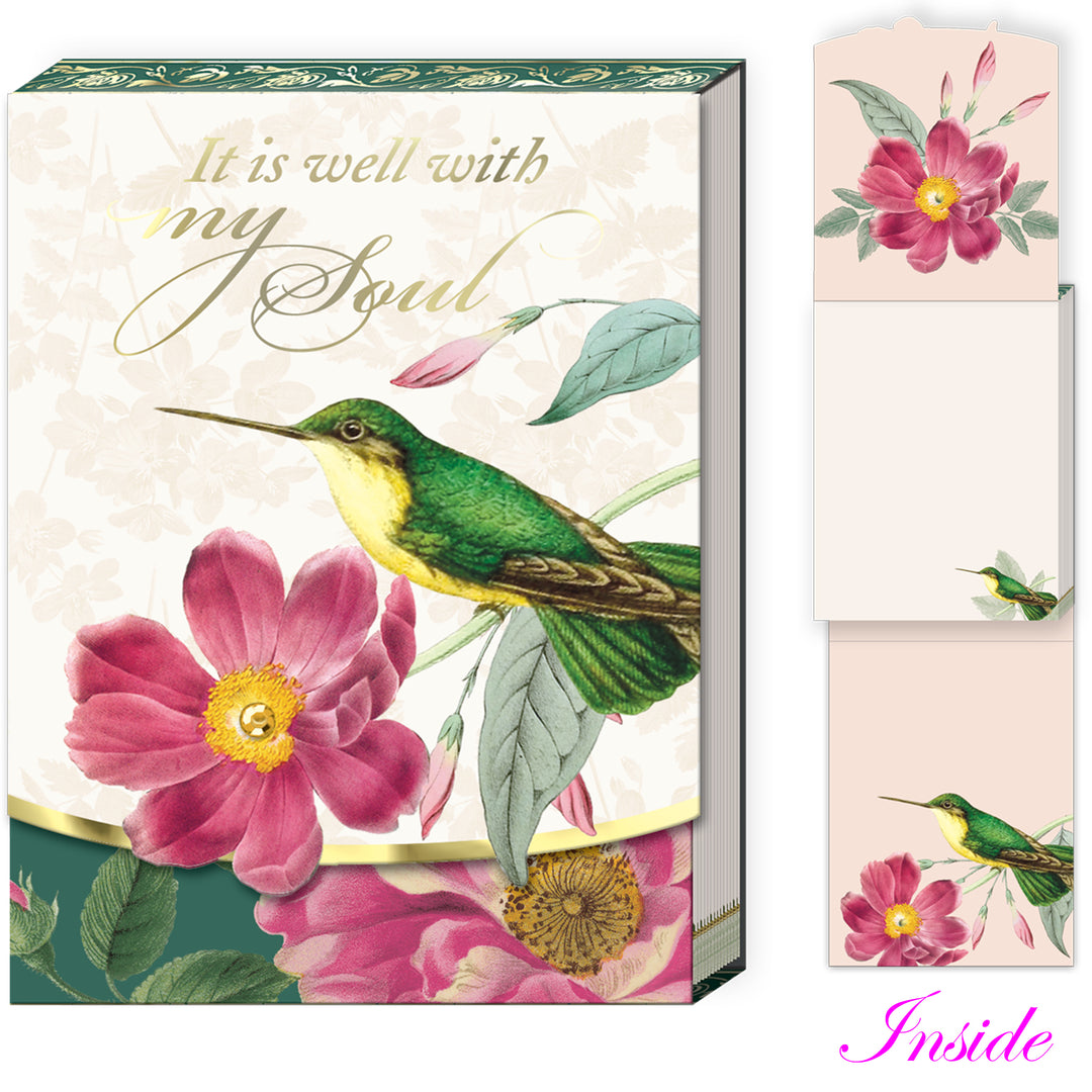 Decorative notepad with hummingbird and floral design, featuring text &