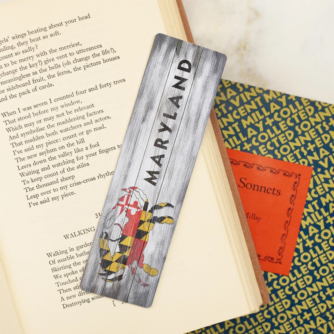 Maryland Rustic Crab Flag Metal Bookmark scene with books.