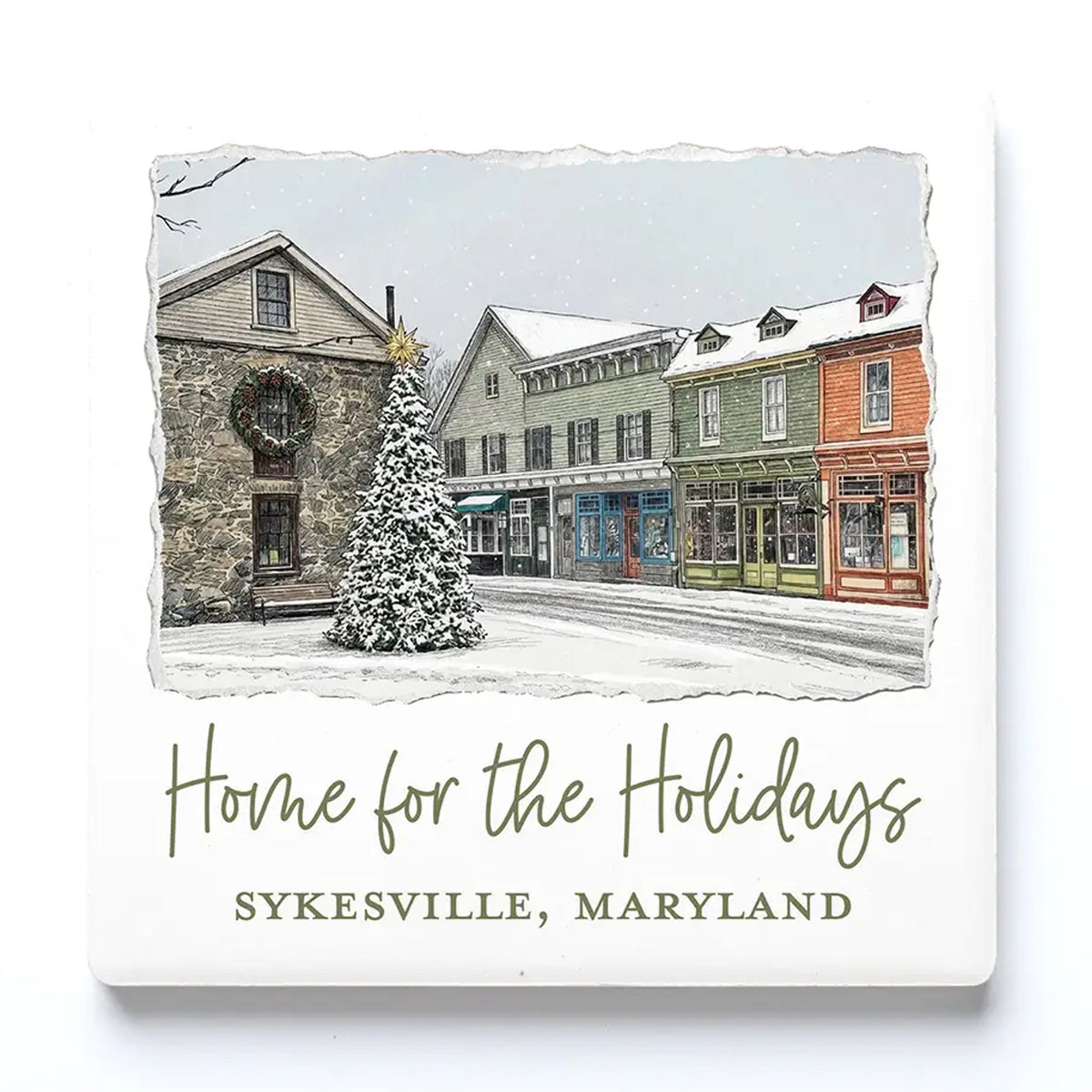 Square ceramic drink coaster featuring a winter street scene in Sykesville, Maryland, with a snow-covered Christmas tree in front of historic buildings. The design includes torn-paper edges and the text 'Home for the Holidays' and 'SYKESVILLE, MARYLAND' on a white background.