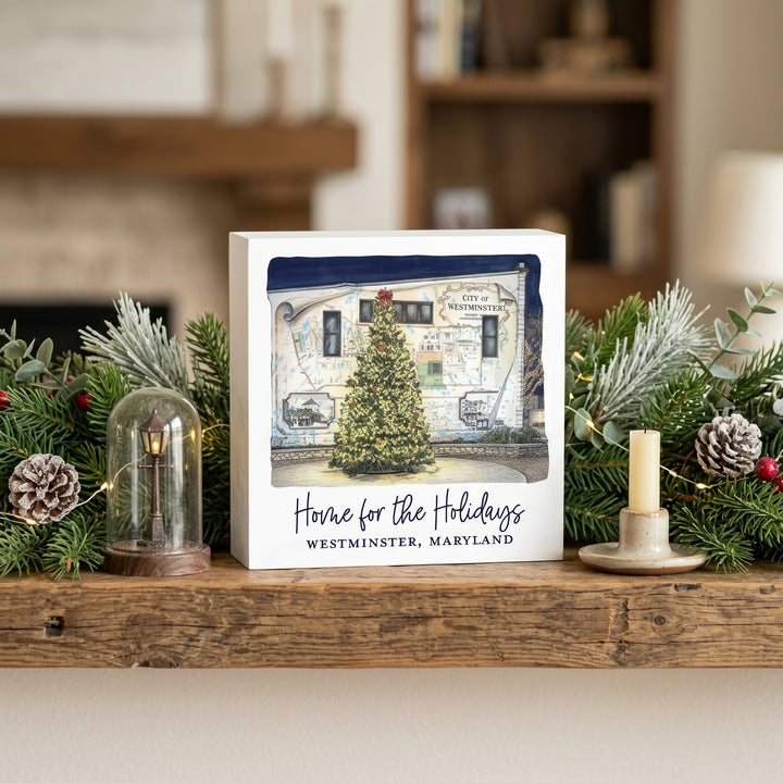 Westminster Maryland Home For The Holidays 5" Box Sign on a shelf decorated for Christmas.
